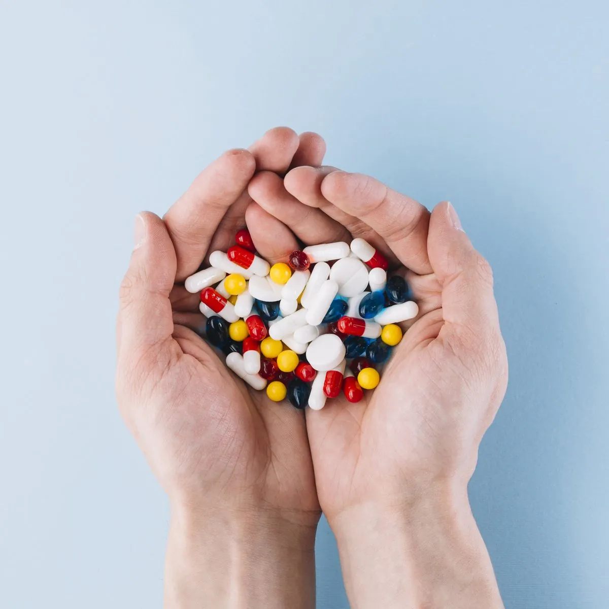 Medication held in cupped hands